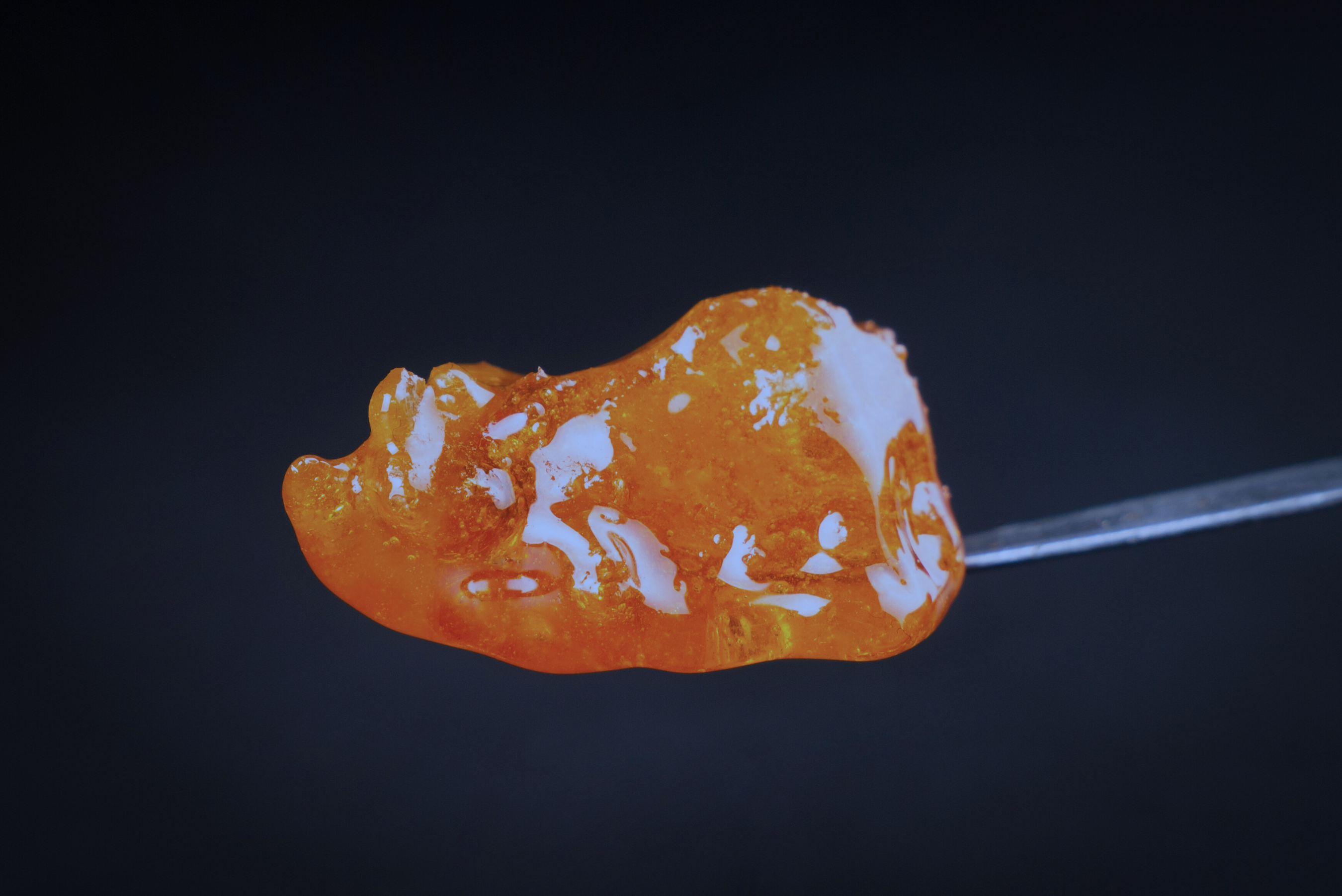 Extraction process showcasing a sample of high-quality concentrate, offered by Rhize nutrients consulting services.