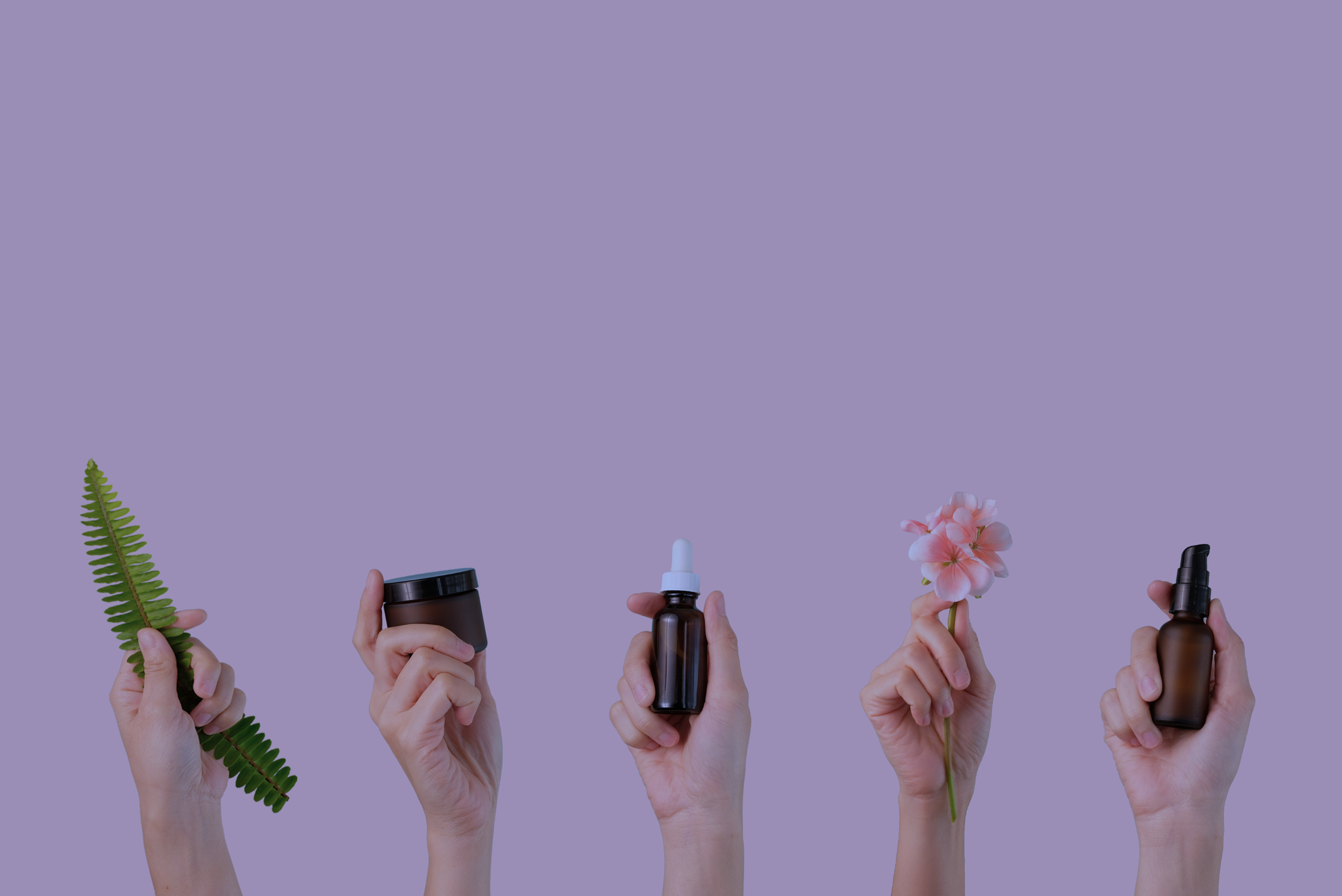 Handings holding various natural health products, highlighting consulting services for NHP by Rhize.